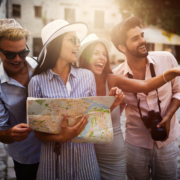 Group of happy friends enjoying sightseeing tour in the city.